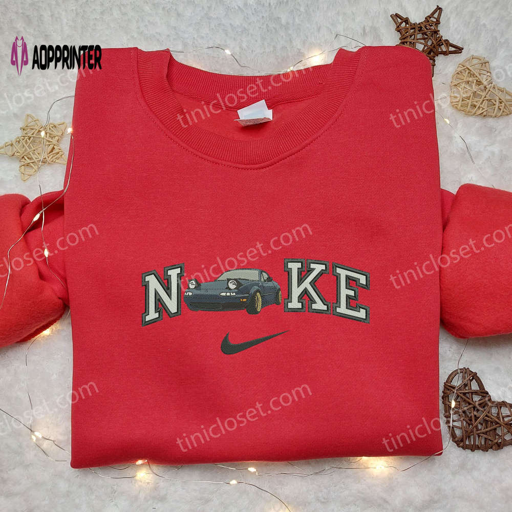Aston martin x nike embroidered shirt: vintage car inspired transportation fashion Embroidered Shirt