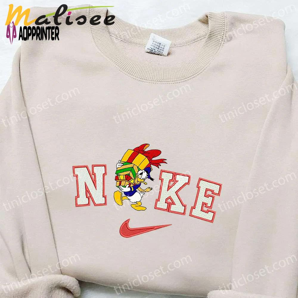 Nike x donald duck gifts embroidered sweatshirt walt disney christmas shirt – best gift ideas Embroidered Shirt