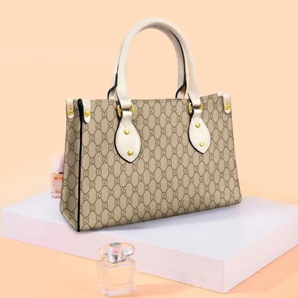 Chic Gucci Logo Tote Bag with Cream Handles and Gold Studs