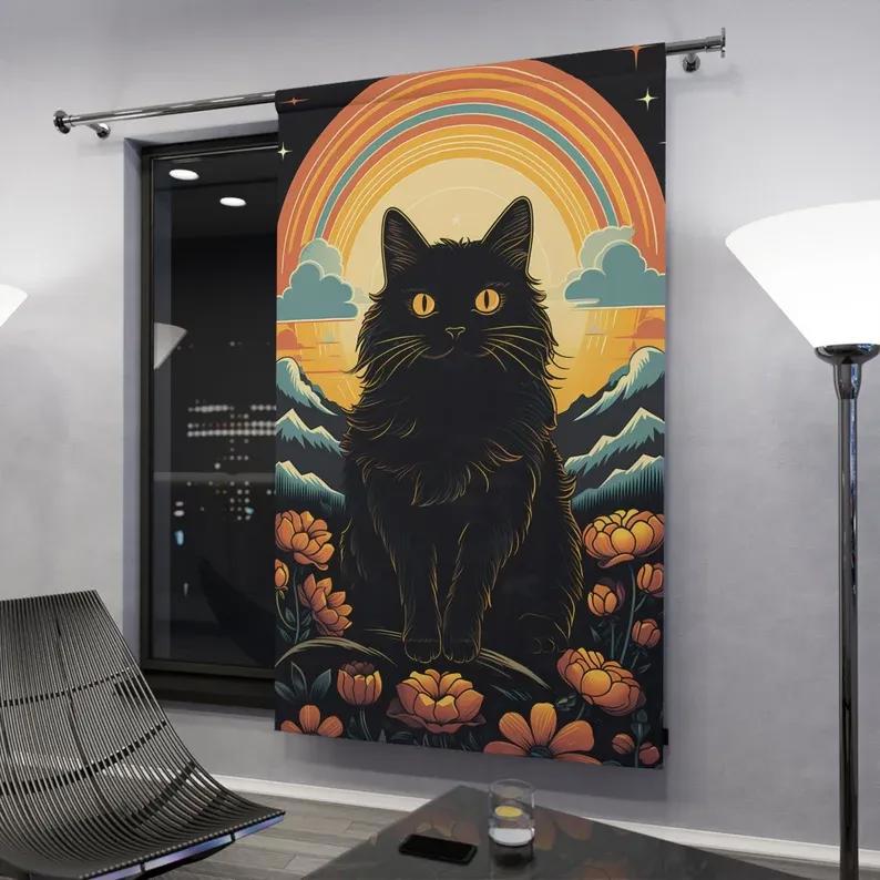 A black cat sitting in front of flowers and a rainbow window curtains